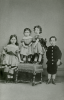 Unknown artist (19th century): Photograph of Alfred A. De Pass as a child with his three sisters, photograph, 15 x 10.5 cms. Presented by Catherine Wallace.