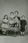 Unknown artist (19th century): Photograph of Alfred A. De Pass as a child with his three sisters, photograph, 15 x 10.5 cms. Presented by Catherine Wallace.