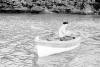 Penrose, Sir Roland (1900-1984): Man Ray in a boat, Lambe Creek, photograph, 29.5 x 39.1 cms. Purchased with grant aid from the Esmee Fairbairn Foundation in 2004. © Roland Penrose Estate. All rights reserved.