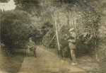 Unknown artist (early 20th century): Henry Scott Tuke painting Howard Fox at Rosehill gardens, photograph, 21 x 29.5 cms.